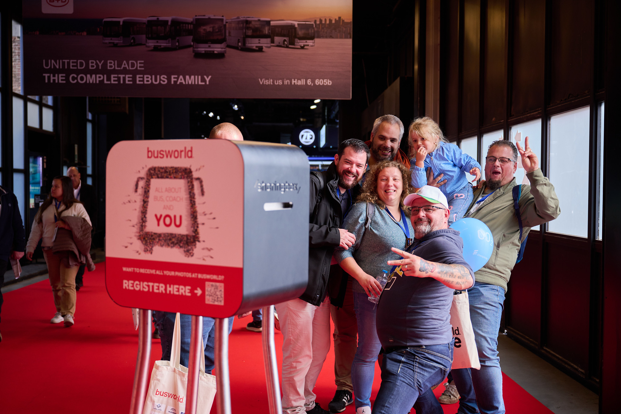 Visitors using the Busworld photobooth at the Busworld Europe 2025 Bus&coach exhibition in Brussels