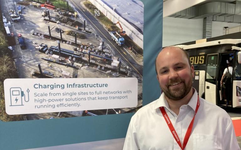 Dorian Van Doorslaer, sales engineer at Reeload, pictured in front of the charging park in the city of Luxembourg