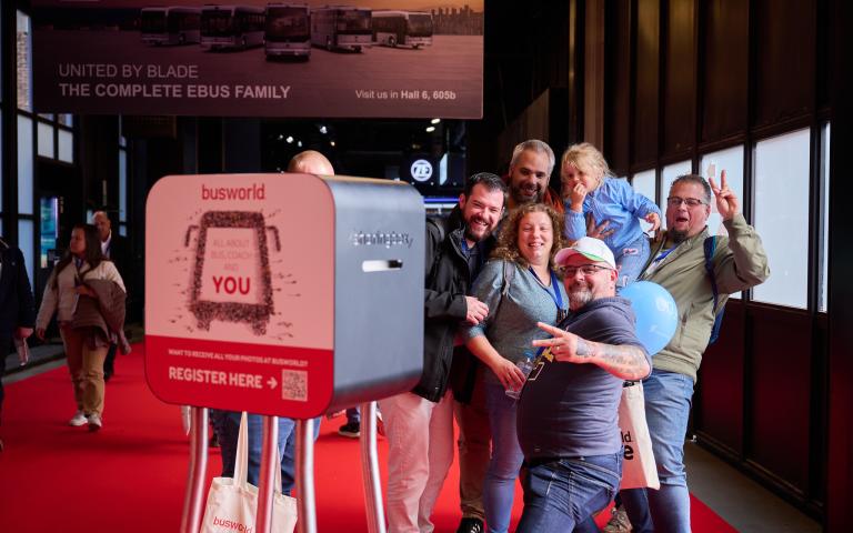 Visitors using the Busworld photobooth at the Busworld Europe 2025 Bus&coach exhibition in Brussels